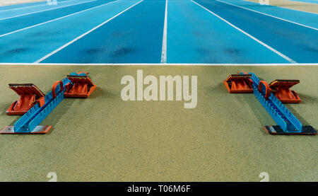 Action packed image; the starting blocks for a sprint run on a track Stock Photo