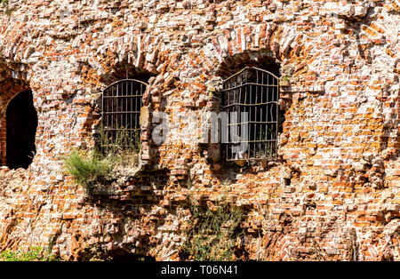 Ruins of the ancient Oreshek fortress. Windows with forged lattice at the medieval fortress in Shlisselburg, Russia Stock Photo