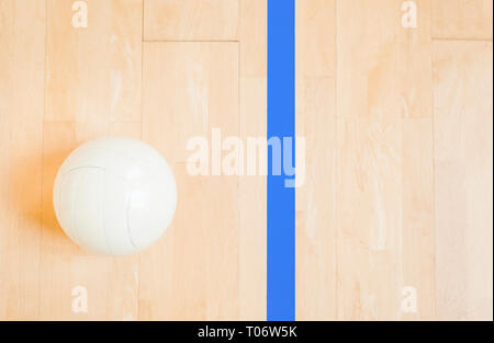 close up of volleyball ball on wooden floor from top Stock Photo