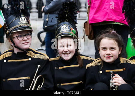 Members of the Irish Marching Band are seen during the St Patrick's Day celebration as the annual parade travels through the streets of central London. Stock Photo