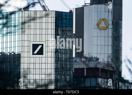 17 March 2019, Hessen, Frankfurt/Main: The headquarters of Deutsche Bank (l) and Commerzbank, pulled together by a telephoto lens. Photo: Frank Rumpenhorst/dpa Stock Photo