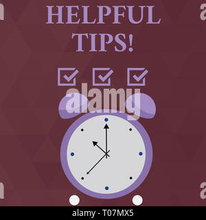 Handwriting text Helpful Tips. Conceptual photo advices given to be helpful knowledge in life Colorful Round Analog Two Bell Alarm Desk Clock with Sec Stock Photo
