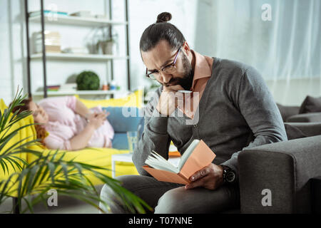 Serious psychologist being deep in his thoughts Stock Photo