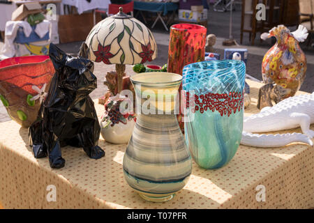 detail of glass vintage vases on sale at street market, shot in bright winter light at Cremona, Lombardy,  Italy Stock Photo