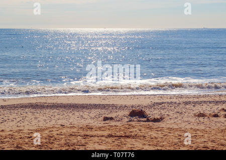 Sunlight reflecting on sparkling blue sea at Southwold beach, a popular seaside town of the UK Stock Photo