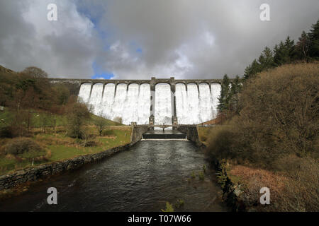 The 56m (184ft) Claerwen dam overflowing after heavy rain in the Elan valley, Powys, Wales, UK. Stock Photo