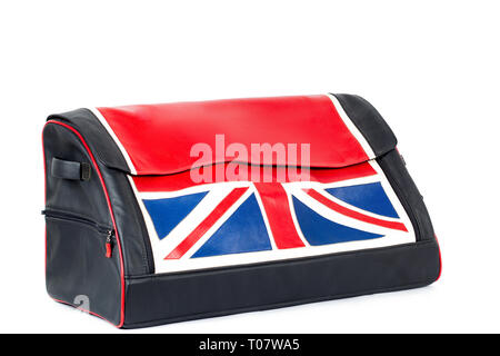 Black-red leather bag with flag UK for storing things and traveling in the trunk of a car on a white isolated background. Luggage, handmade suitcase Stock Photo