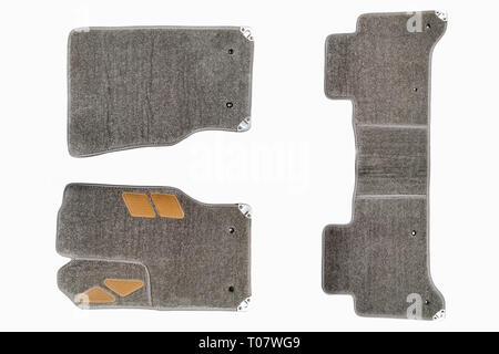 Gray-brown floor mats of carpet, velor for the front and rear seats of the car on a white isolated background, top view. Stock Photo