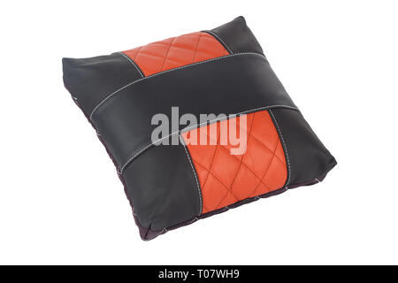 Black-red small handmade pillow with white stitching from genuine leather on a white isolated background, side view. Stock Photo