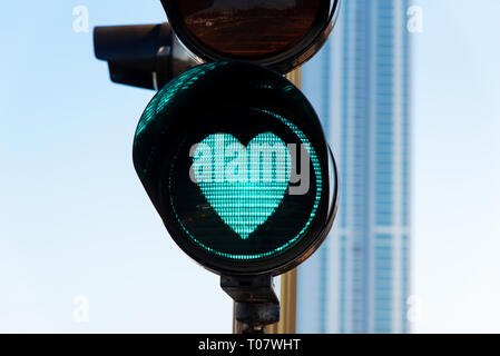 Heart shaped traffic light on the street close up Stock Photo