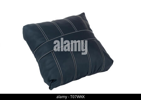Black small handmade pillow with white stitching from genuine leather on a white isolated background, side view. Stock Photo
