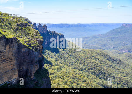 View of Jamison Valley and the 'Three Sisters' seen from a lookout near Prince Henry Cliff Walk, Blue Mountains National Park, NSW, Australia. Stock Photo