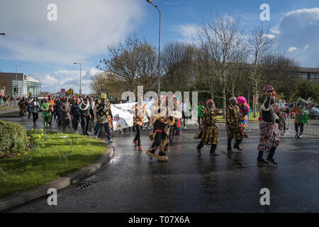 African community in traditional Nigerian costumes celebrating St. Patrics Day on a parade in Dublin, Blanchardstown Stock Photo