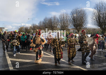 African community in traditional Nigerian costumes celebrating St. Patrics Day on a parade in Dublin, Blanchardstown Stock Photo