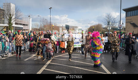 African community in traditional Nigerian costumes celebrating St. Patrics Day on a parade in Dublin, Blanchardstown Stock Photo