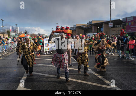 African community in traditional Nigerian costumes celebrating St. Patrics Day on a parade in Dublin, Blanchardstown Stock Photo