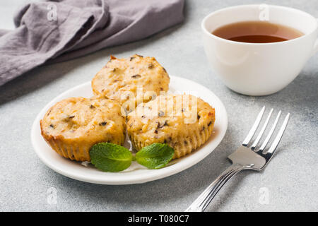 Oatmeal vegetarian muffins with blueberries and nuts on a plate Concept healthy Breakfast. Stock Photo