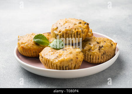 Oatmeal vegetarian muffins with blueberries and nuts on a plate Concept healthy Breakfast. Stock Photo