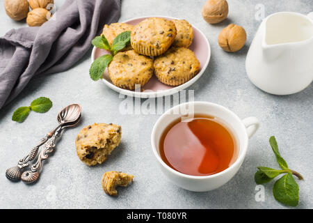 Oatmeal vegetarian muffins with blueberries and nuts on a plate Concept healthy Breakfast. Stock Photo