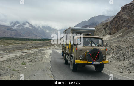 Ladakh, India - Jul 19, 2015. A truck running on mountain road in Ladakh, India. Ladakh is renowned for its remote mountain beauty and culture. Stock Photo