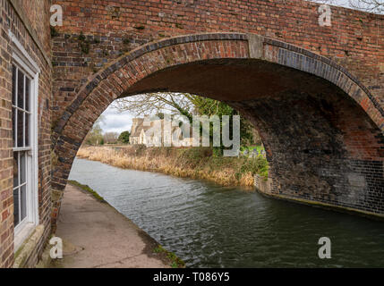 A view through Nutshell Bridge of St. Cyr’s Church Stonehouse. On the restored Stroud water Navigation, United Kingdom Stock Photo