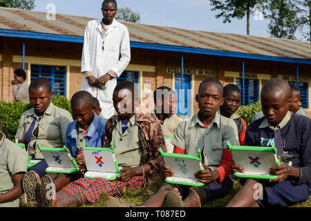 RWANDA, Ruhengeri, Primary school, Initiative One laptop per child OLPC founded by Nicholas Negroponte, digital education for children using a XO laptop, the so called 100 Dollar computer - digitalization Stock Photo