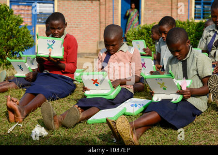 RWANDA, Ruhengeri, Primary school, Initiative One laptop per child OLPC founded by Nicholas Negroponte, digital education for children using a XO laptop, the so called 100 Dollar computer - digitalization Stock Photo