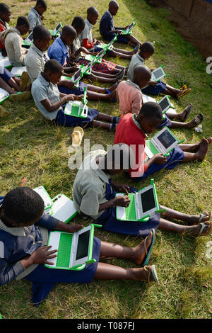 RWANDA, Ruhengeri, Primary school, Initiative One laptop per child OLPC founded by Nicholas Negroponte, digital education for children using a XO laptop, the so called 100 Dollar computer - digitalization Stock Photo