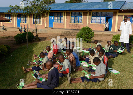 RWANDA, Ruhengeri, Primary school, Initiative One laptop per child OLPC founded by Nicholas Negroponte, digital education for children using a XO laptop, the so called 100 Dollar computer - digitalization Stock Photo