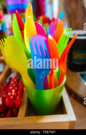 Colourful child safe plastic cutlery Stock Photo