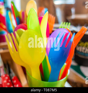 Colourful child safe plastic cutlery Stock Photo