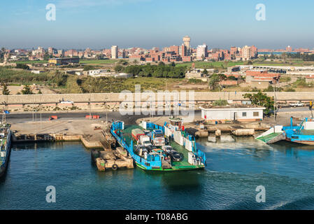 El Qantara, Egypt - November 5, 2017: Cars Ferryboat moored to the shore on the Suez Canal in the city El Qantara located in the Egyptian governorate  Stock Photo