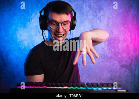 Portrait of funny nerd working on computer Stock Photo