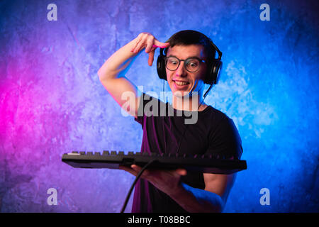 Portrait of funny nerd working on computer Stock Photo