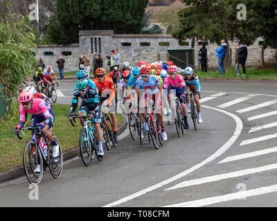 Beulle, France - March 10, 2019: The peloton riding on Cote de Beulle during the stage 1 of Paris-Nice 2019. Stock Photo