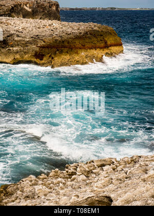 Waves Crashing on Limestone Cliffs,The Queens Baths, Tidal Pools, Gregory Town, Eleuthera, The Bahamas, The Caribbean. Stock Photo