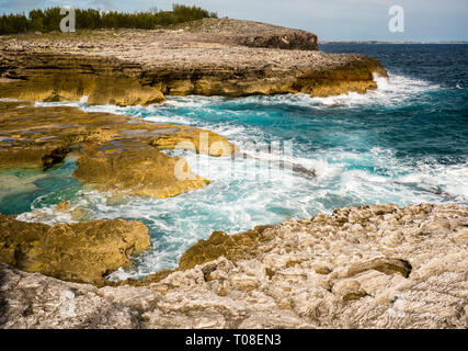 Waves Crashing on Limestone Cliffs,The Queens Baths, Tidal Pools, Gregory Town, Eleuthera, The Bahamas, The Caribbean. Stock Photo