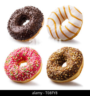 Set of fresh donuts with strawberries, chocolate and caramel isolated on white background Stock Photo