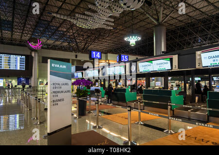 Taipei, Taiwan - February 2019: Eva Air check-in counter in Taipei  Taoyuan International Airport. Eva Air is one of the major airlines in the world Stock Photo