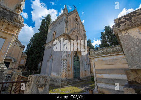 Old crypts and tombs in baroque style in Old Roman cemetery park (Cimitero Storico) in Lecce, Puglia, Italy. A region of Apulia Stock Photo