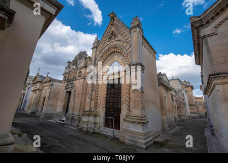 Old crypts and tombs in baroque style in Old Roman cemetery park (Cimitero Storico) in Lecce, Puglia, Italy. A region of Apulia Stock Photo