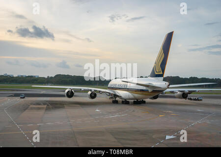 Singapore - January 2018: Singapore Airlines aircraft on the runway of Singapore Changi Airport. Singapore Airlines is the flag carrier airline Stock Photo