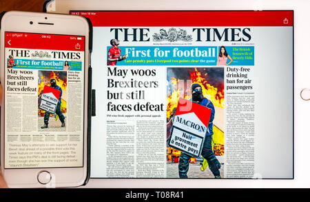 Mobile phone screen and tablet device screen showing BBC News app with front cover of The Times newspaper reporting Brexit on screen Stock Photo