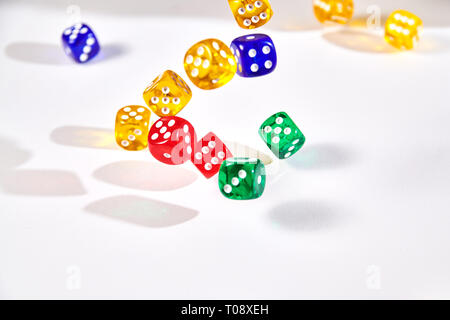 colorful dices in motion on white background Stock Photo