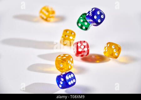 colorful dices in motion on white background Stock Photo