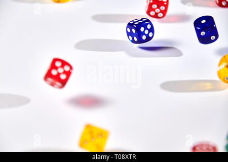 colorful dices in motion on white background Stock Photo
