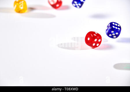 colorful dices in motion on white background Stock Photo