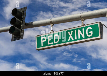 LAS VEGAS, NV, USA - FEBRUARY 2019: Road sign overhead on Las Vegas Boulevard warning drivers of a pedestrian crossing ahead. Stock Photo