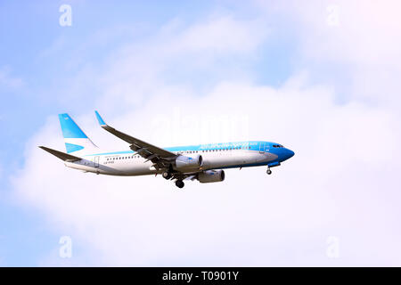 Buenos Aires, Argentina - March 18, 2019: Aerolineas Argentinas plane flying over Buenos Aires in Capital Federal, Buenos Aires, Argentina