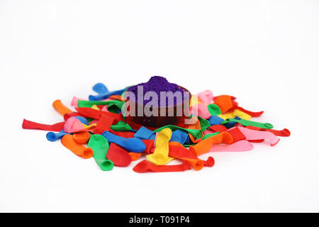 Picture of purple color and many water balloons for holi festival. Isolated on the white background. Stock Photo